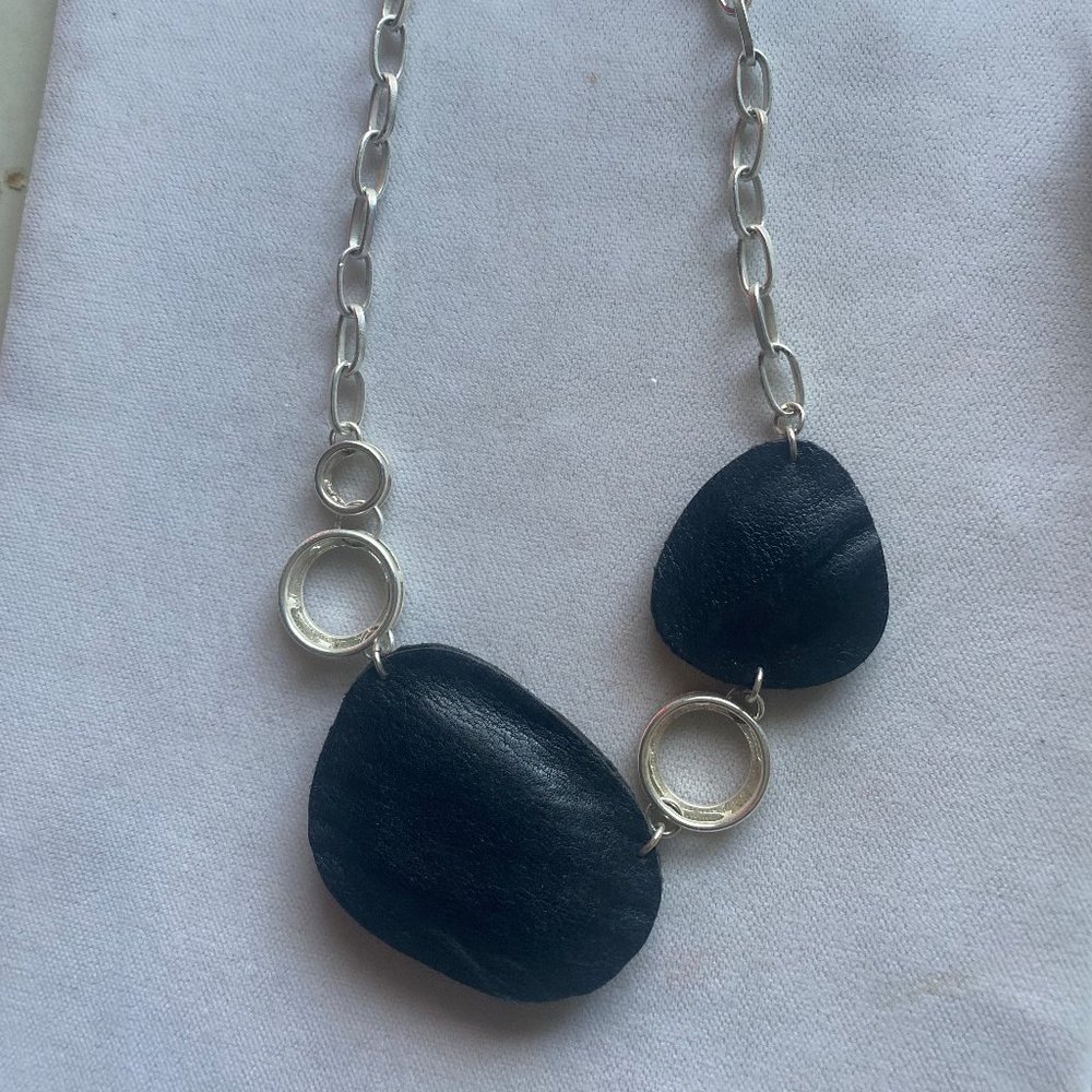 Silver tone and faux leather necklace